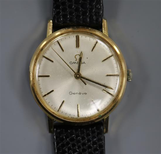 A gentlemans gold plated and steel Omega manual wind mid-size wrist watch.